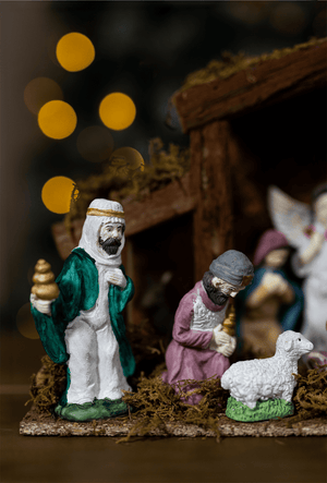 Three Wise Men bringing gifts in detailed Nativity scene