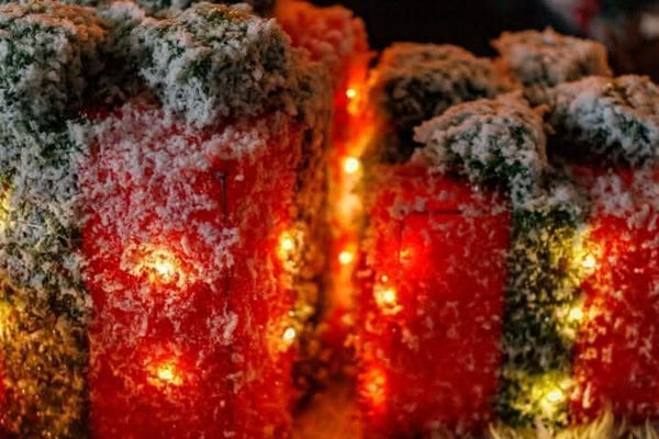 LED Christmas gift boxes arranged as festive centrepiece