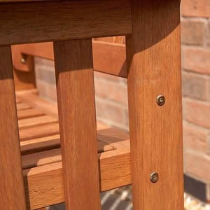 Garden love seat with drinks placed on the centre table