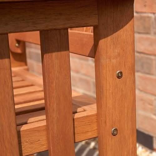 Garden love seat with drinks placed on the centre table