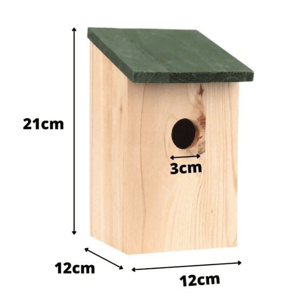 Green wooden bird house displayed in a garden