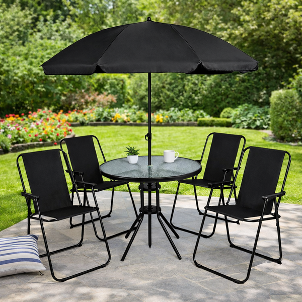 Outdoor table and chairs arranged beneath a parasol
