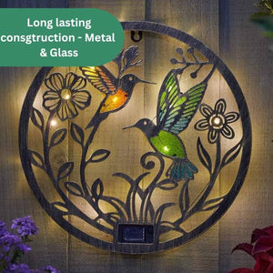 Elegant solar wall décor with warm white illumination.