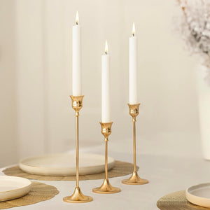 Gold taper candle holders with white candles set