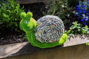 Grass effect resin snail displayed on lawn
