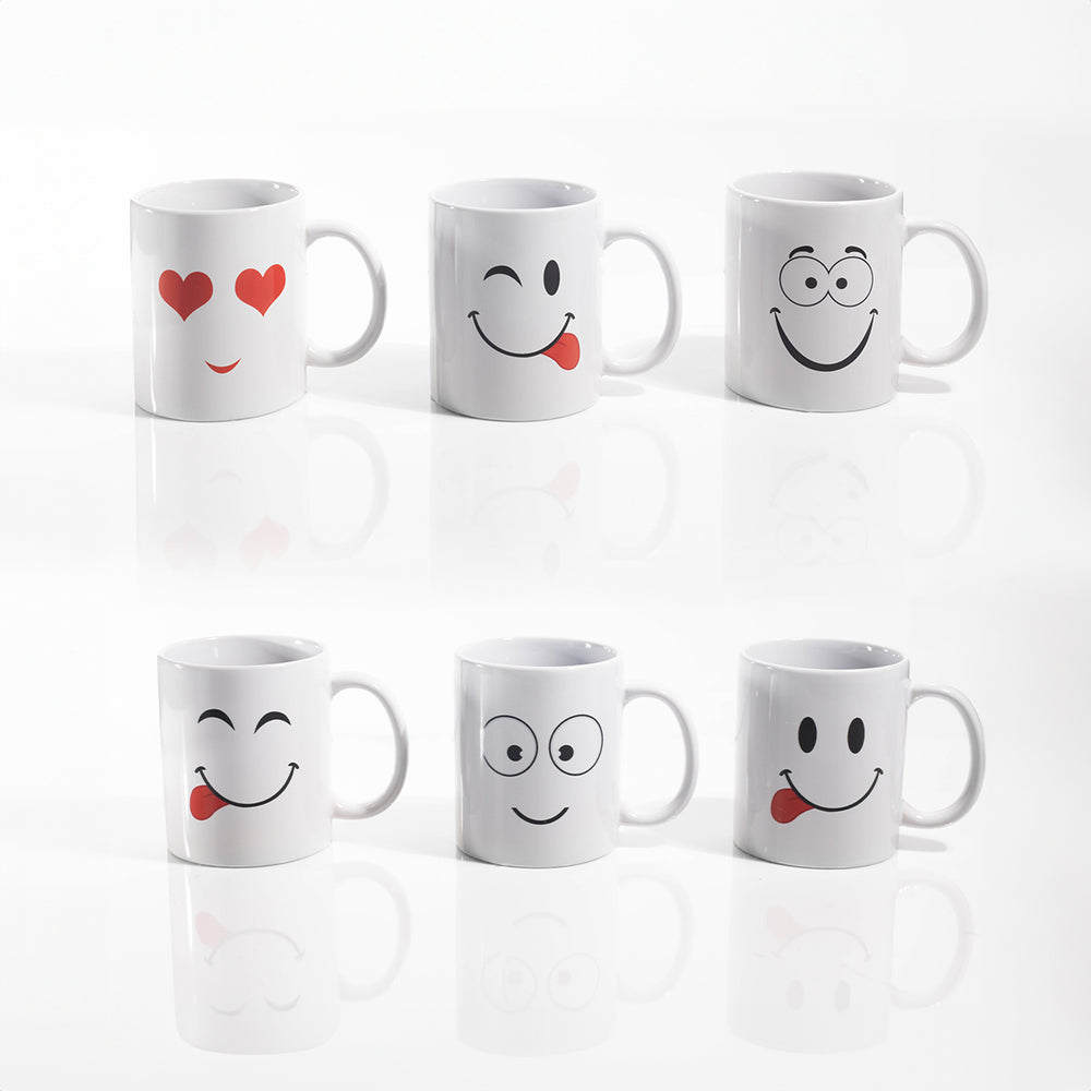 A set of white porcelain mugs with various playful facial expressions and heart symbols designed on them.