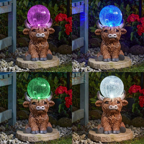 Crackle glass ball illuminated on Highland cow ornament
