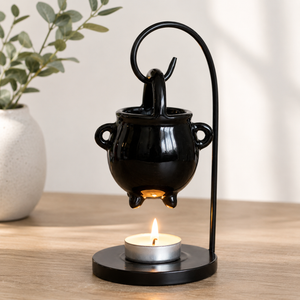Halloween fragrance burner styled with witch themed décor