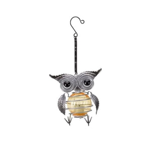 Hanging owl ornament displayed from an outdoor hook