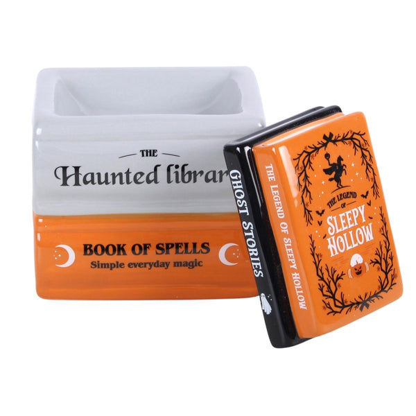 Ceramic book stack burner arranged with Halloween décor