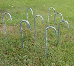 Eight galvanised metal ground stakes in a complete set