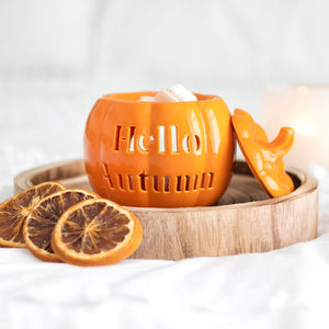 Seasonal wax melt holder styled with cosy autumn décor