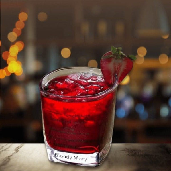 Cocktail recipe booklet with four glasses