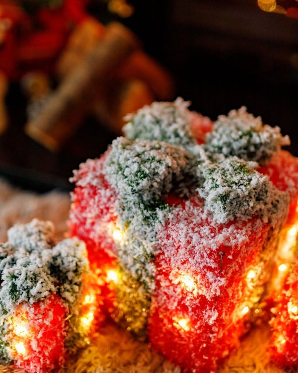 Three Christmas gift boxes with warm white LED illumination