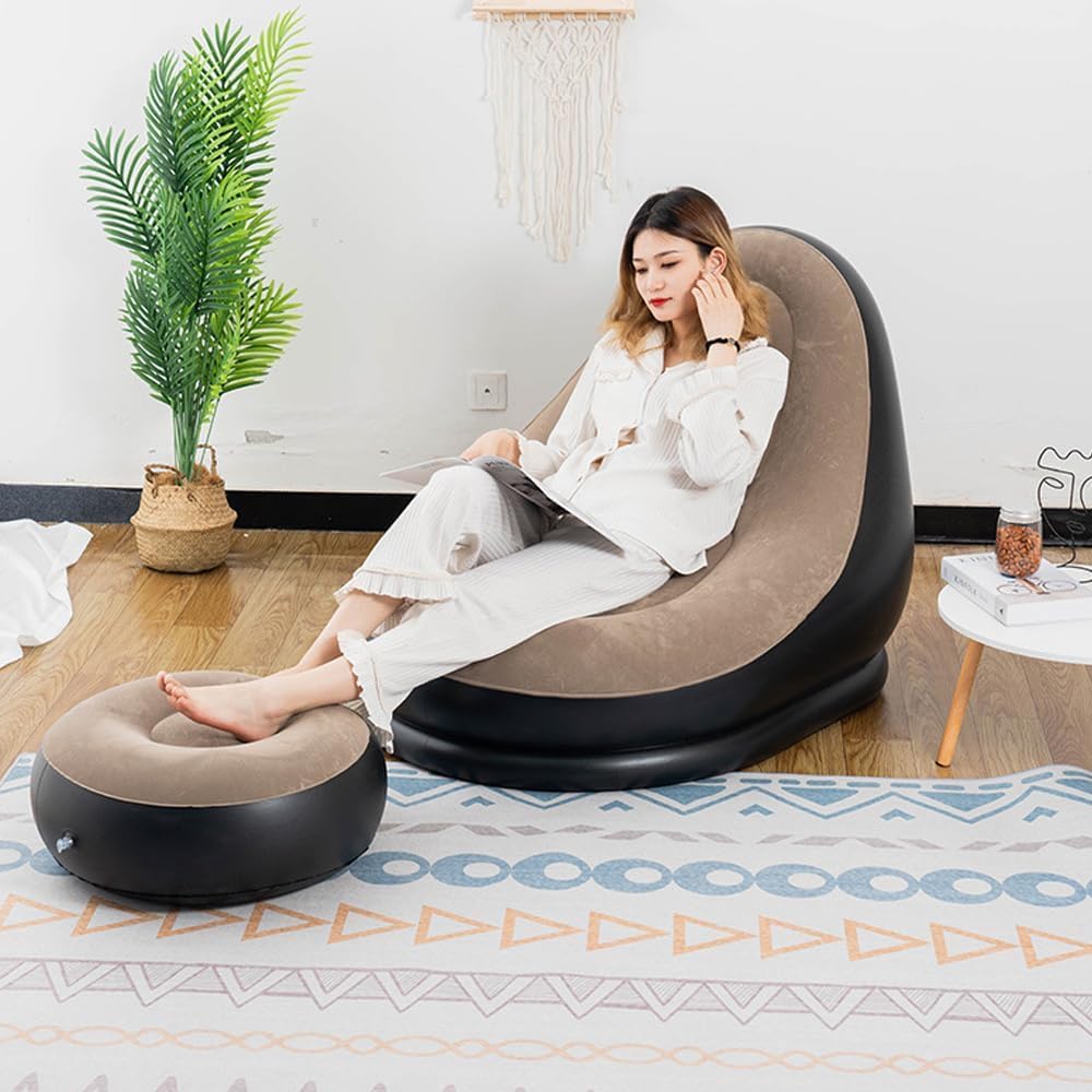 Black inflatable lounger chair with footstool.