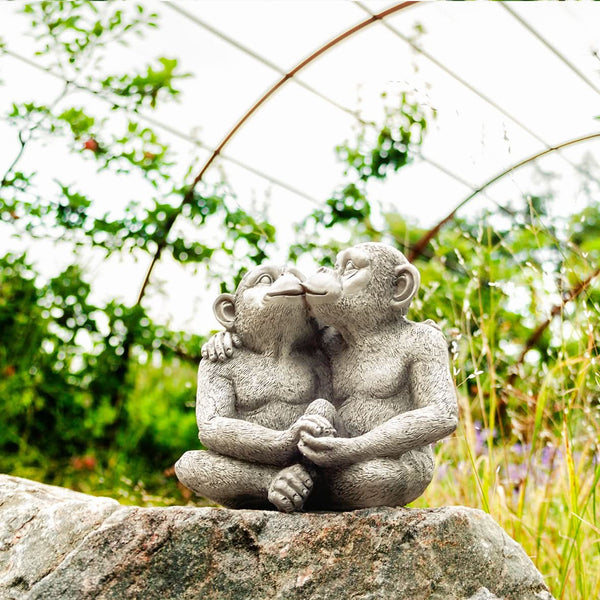 Resin monkey couple ornament shown from the front