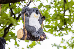 Swinging koala ornament displayed outdoors