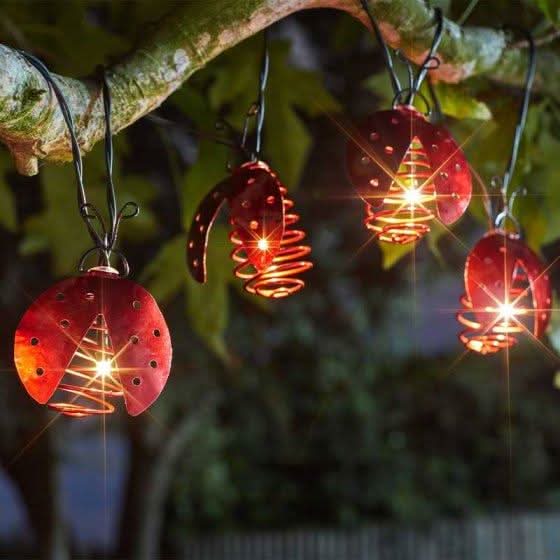 Set of 10 ladybird solar string lights with warm white LEDs