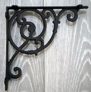 Pair of large cast iron Victorian shelf brackets