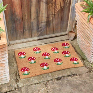 Large mushroom coir door mat at front entrance