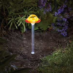 Large yellow mushroom solar garden stake light for outdoor display