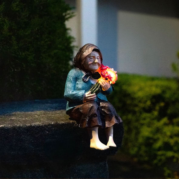 Solar powered garden ornament with LED light