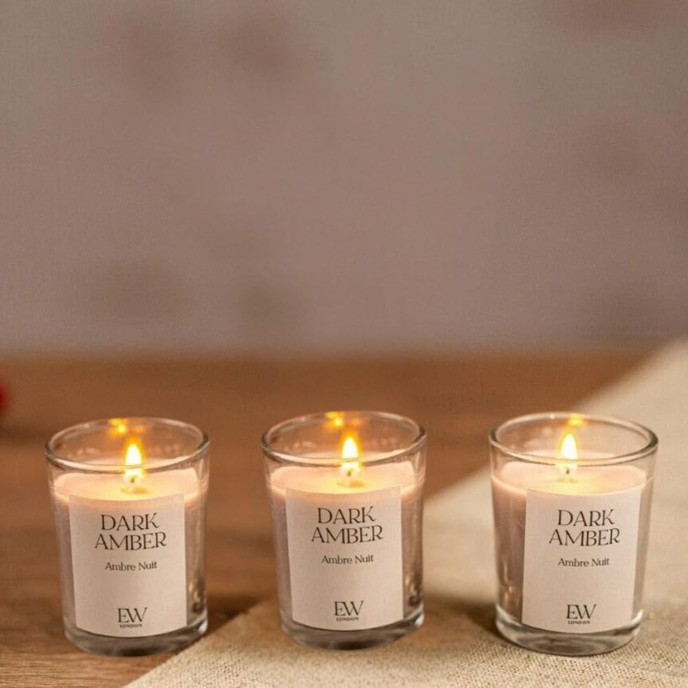 Dark amber scented soy wax candle in glass
