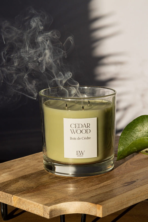Soy wax candle with three illuminated cotton wicks