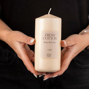 Elegant white candle providing ambient home fragrance