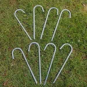 Metal anchors used around a garden structure