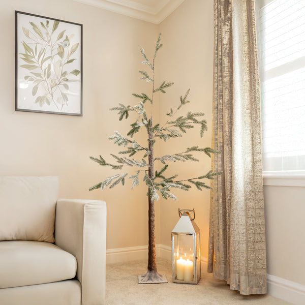 Pre-lit birch tree shown with woven basket base