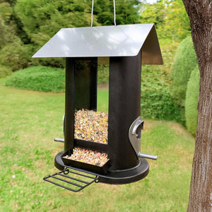 Metal hanging bird seed feeder with four feeding ports.