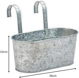 Rectangular metal planter hanging on railing