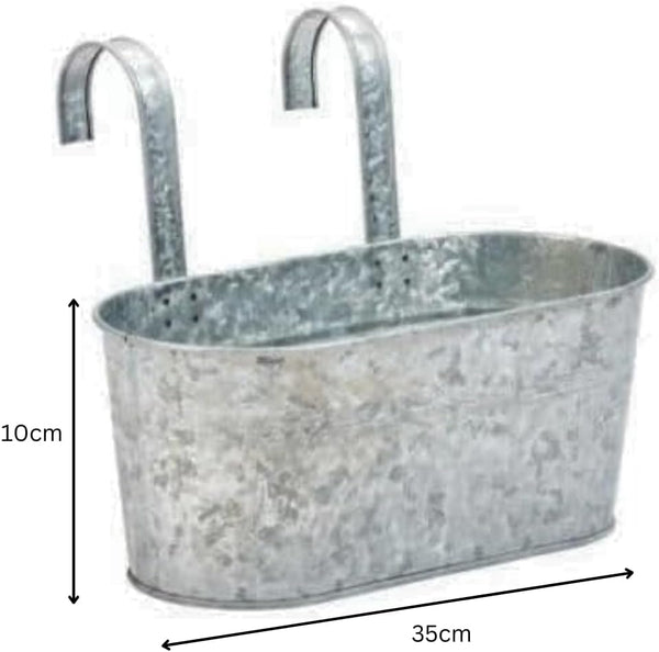 Rectangular metal planter hanging on railing