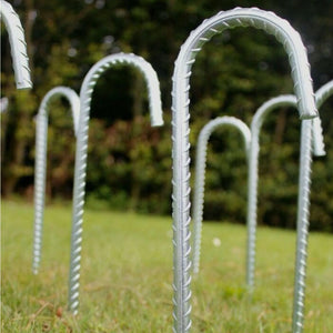 Galvanised stakes positioned beside a gazebo