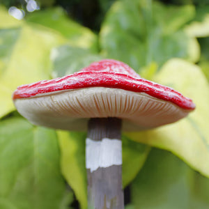 Four toadstool ornaments with stake bases