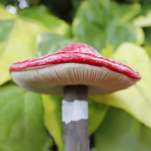Four toadstool ornaments with stake bases