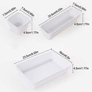 White plastic drawer organiser trays shown together