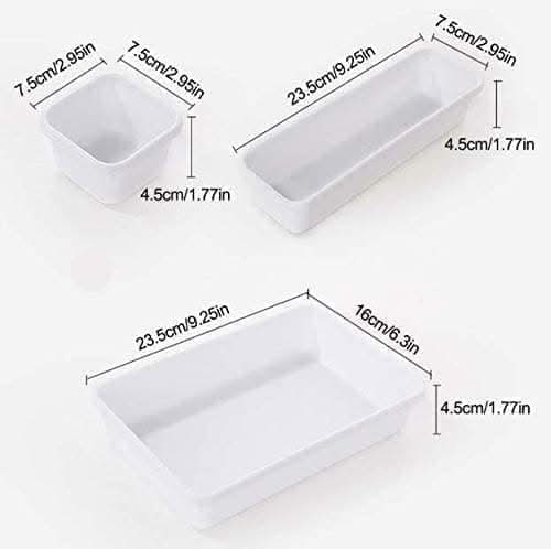 White plastic drawer organiser trays shown together
