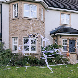 Halloween spider web decoration in front of a house