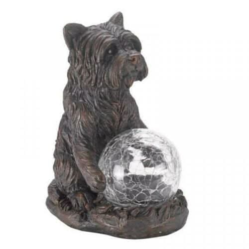 Solar powered dog ornament displayed in garden