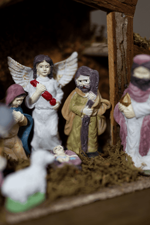 Nativity scene ornament displayed on festive mantelpiece