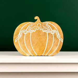 Mango wood pumpkin displayed with farmhouse seasonal décor