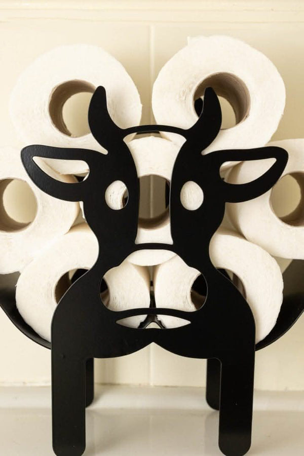 Black metal toilet roll holder displayed in a bathroom