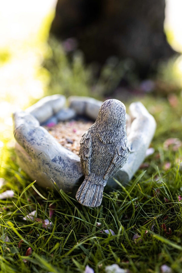 Decorative garden bird feeder sculpture
