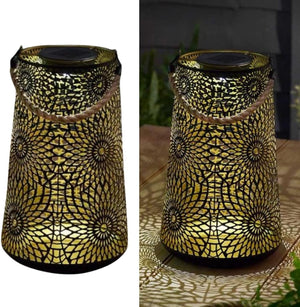 Decorative solar lantern illuminating an outdoor seating area.