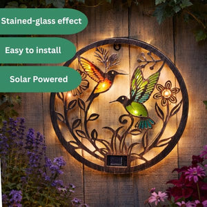 Glass and iron hummingbird wall light for outdoors.