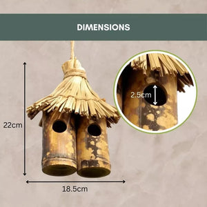 Decorative rustic bird house hanging from tree