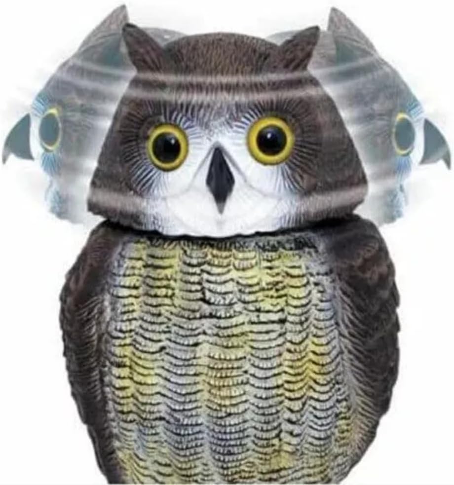 Plastic owl figurine on a wooden surface with a blurred natural background
