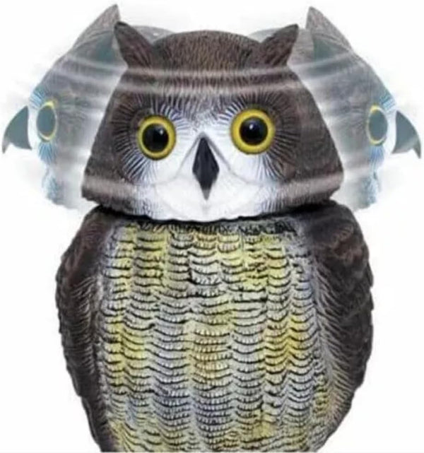 Realistic swivel head owl bird deterrent in garden